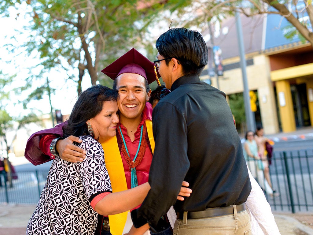 graduating student celebrating with family