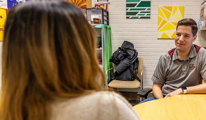 academic advisor talking with an undergraduate student