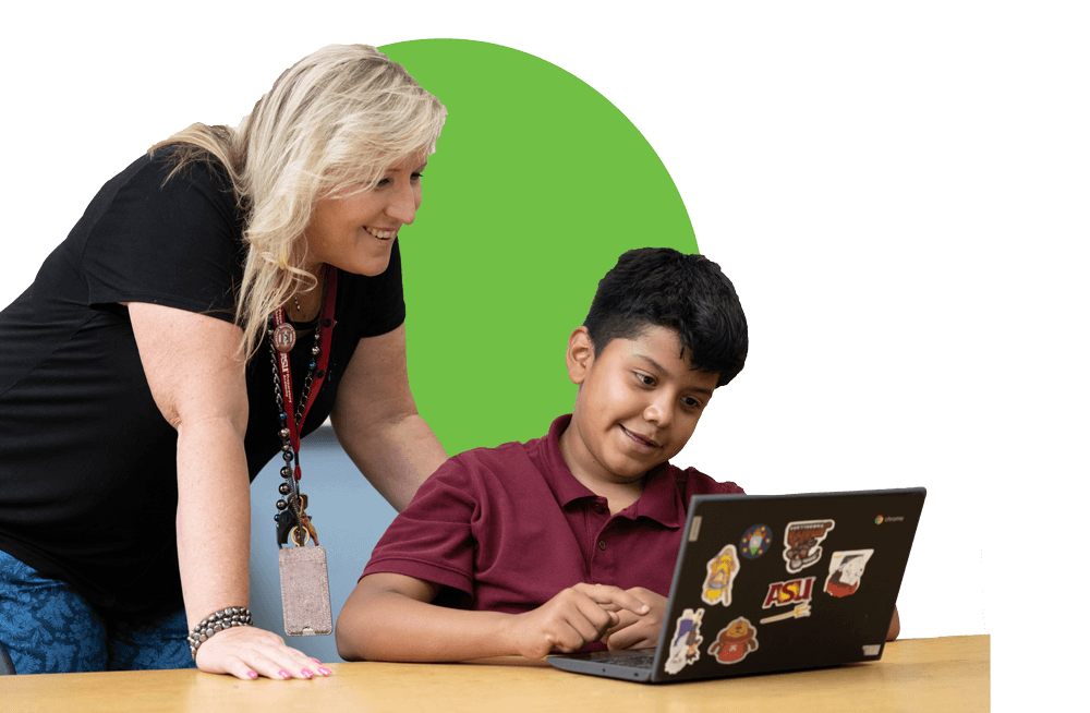 Educator helping a student using a laptop