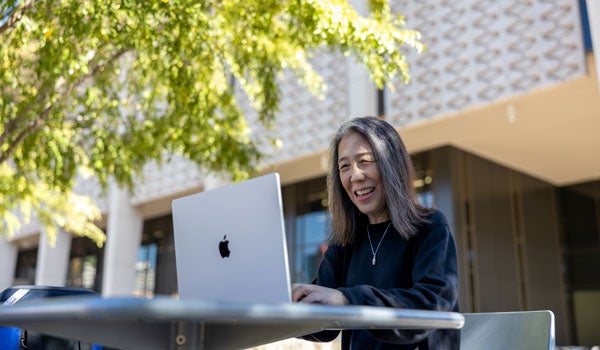 graduate student studying outside