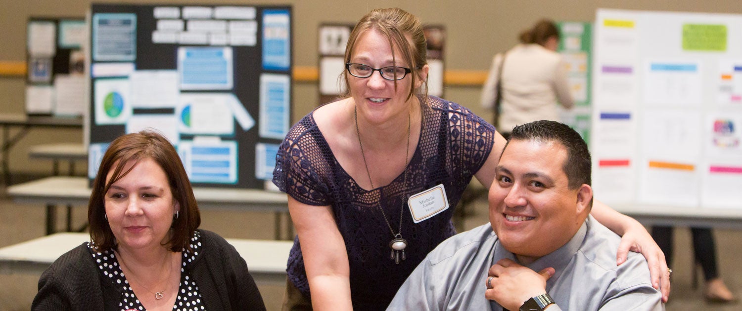 people smiling in a professional meeting