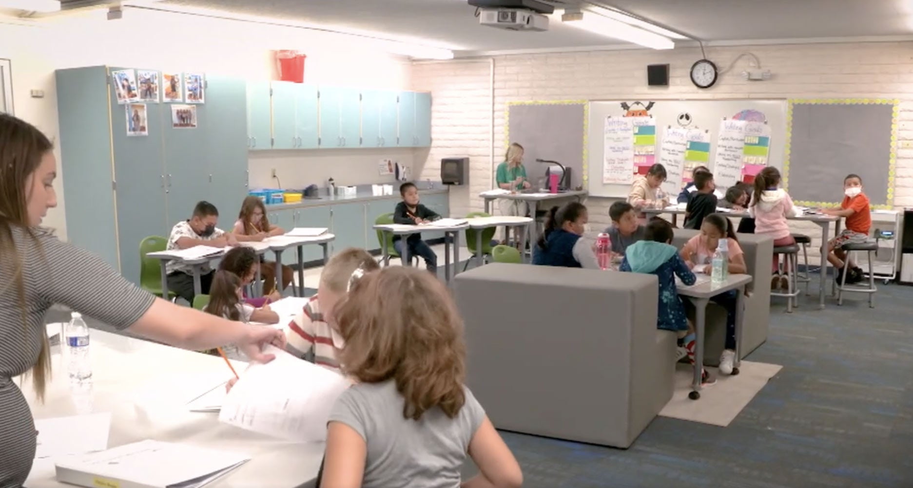 Teacher facilitating classroom of students