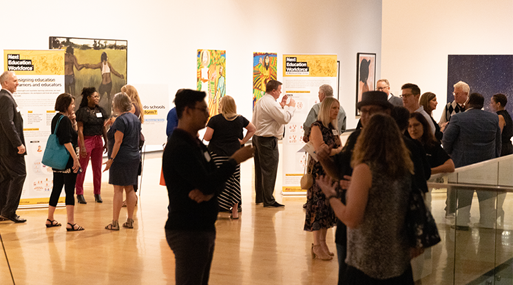 Participants browse exhibits and talk to educators at the Night at the Museum event.