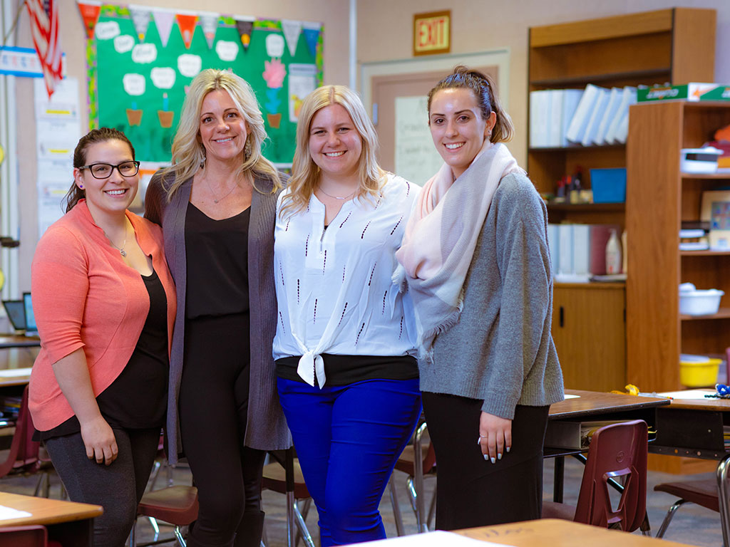 alumni teachers in a classroom