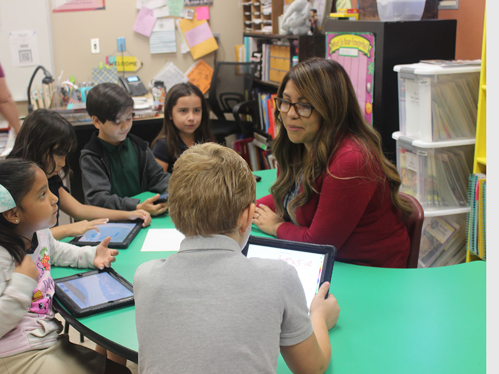 teacher in a classroom with elementary school students