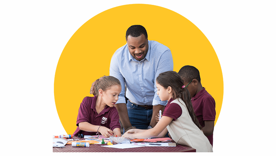 Teacher helping students with a project