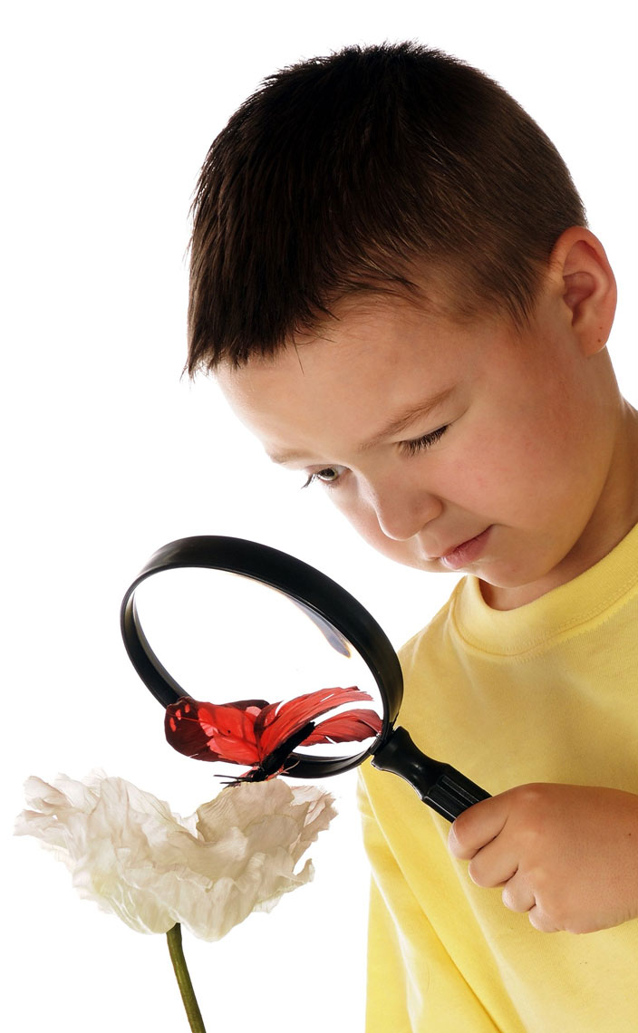 preschooler looking through a magnifying glass