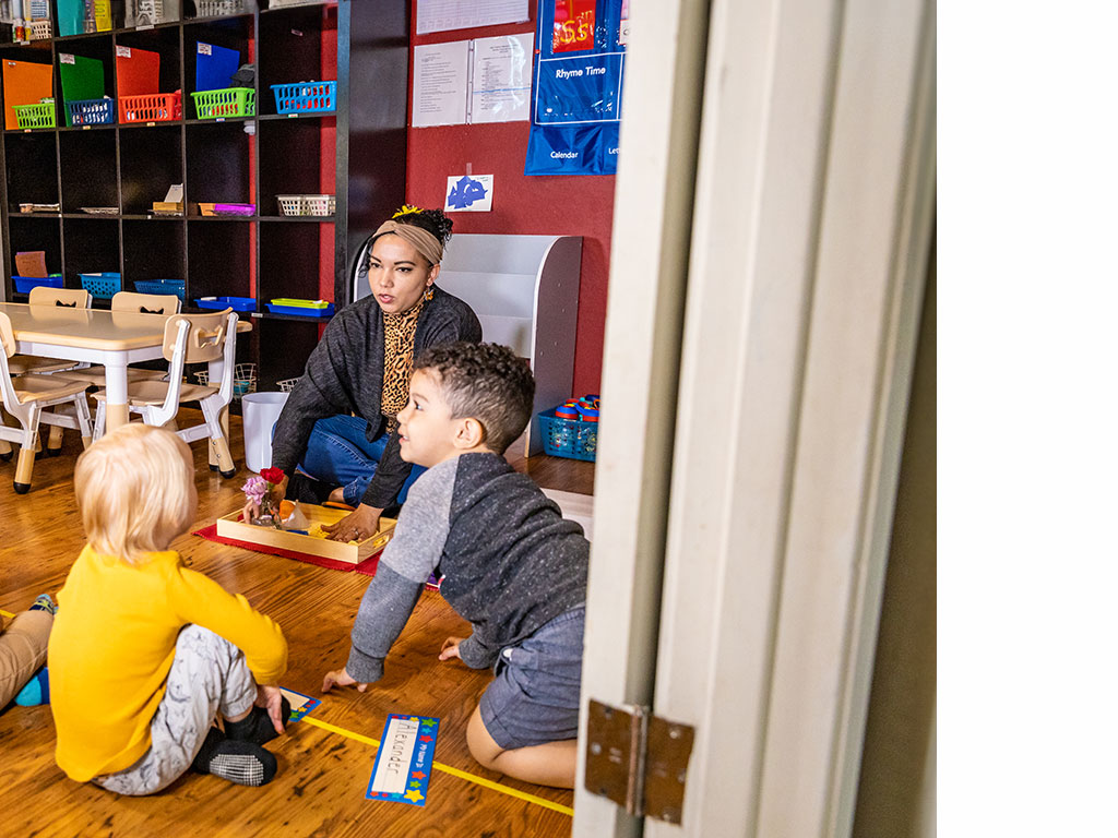 preschool teacher guiding preschoolers in a lesson