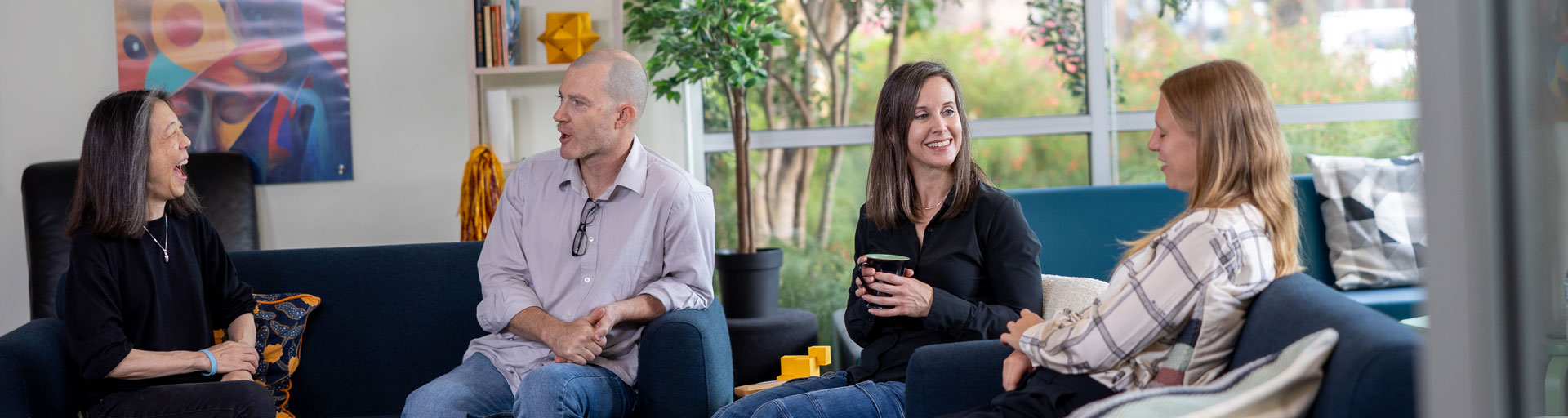 people sitting in a lounge having a discussion